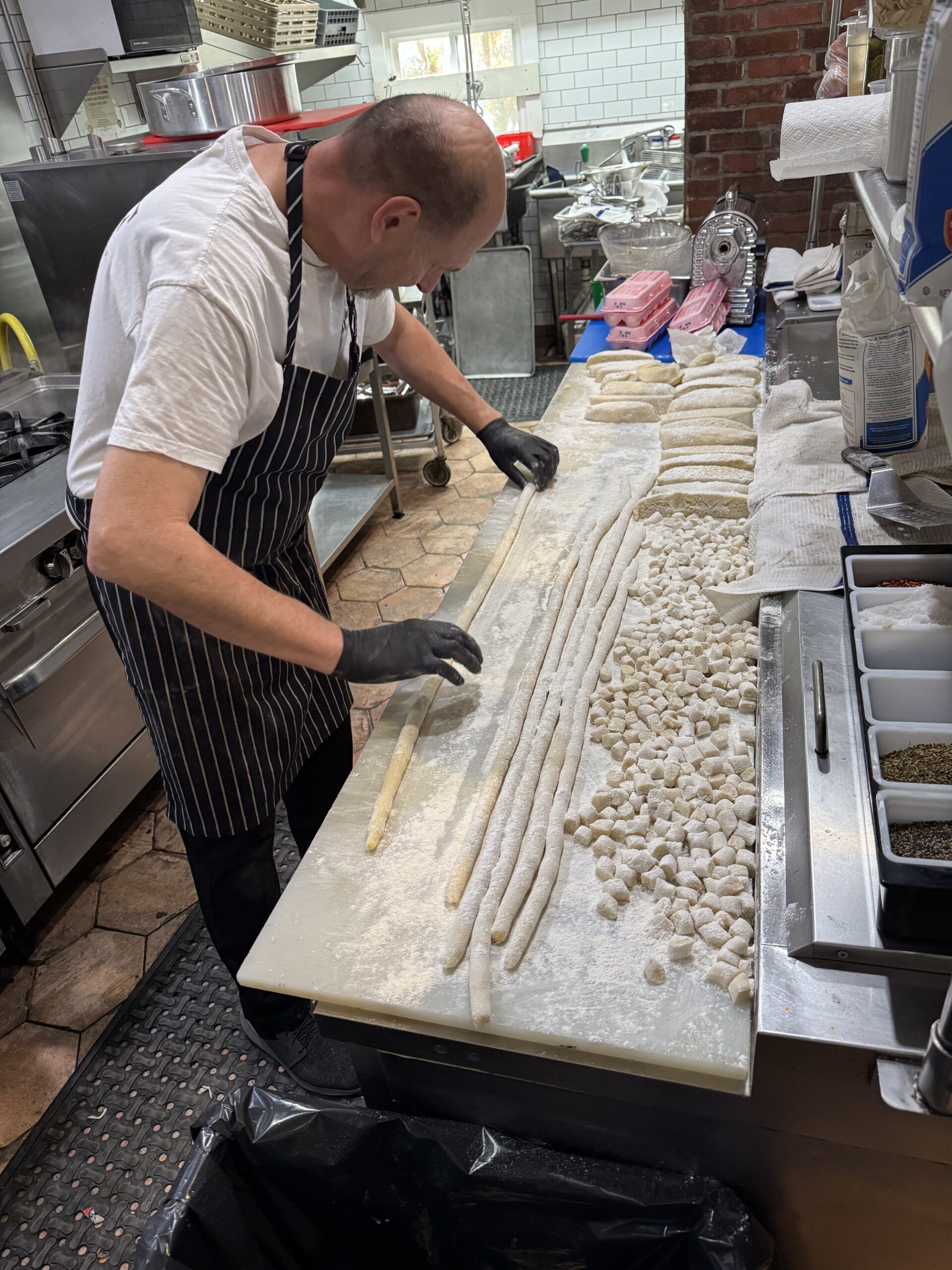 Chef Maurizio Peccolo preparing food in the kitchen