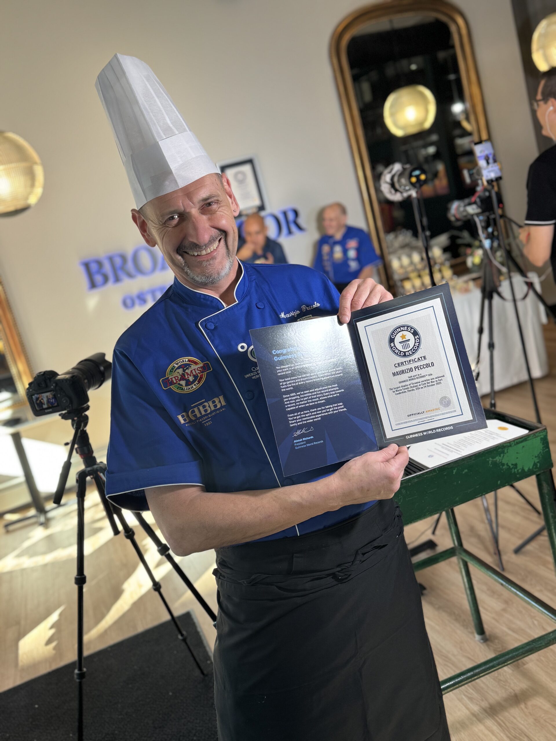 Chef Maurizio Peccolo holding an award